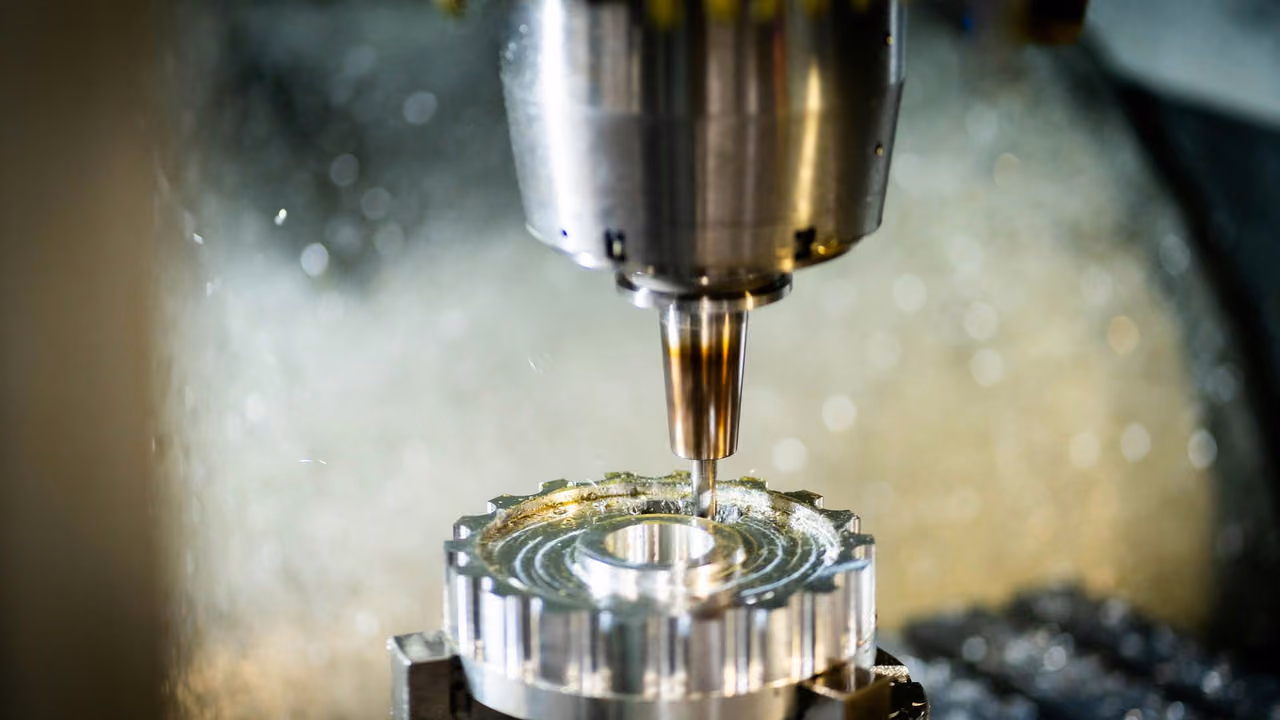 Milling cutter machining a metal part in a CNC machine