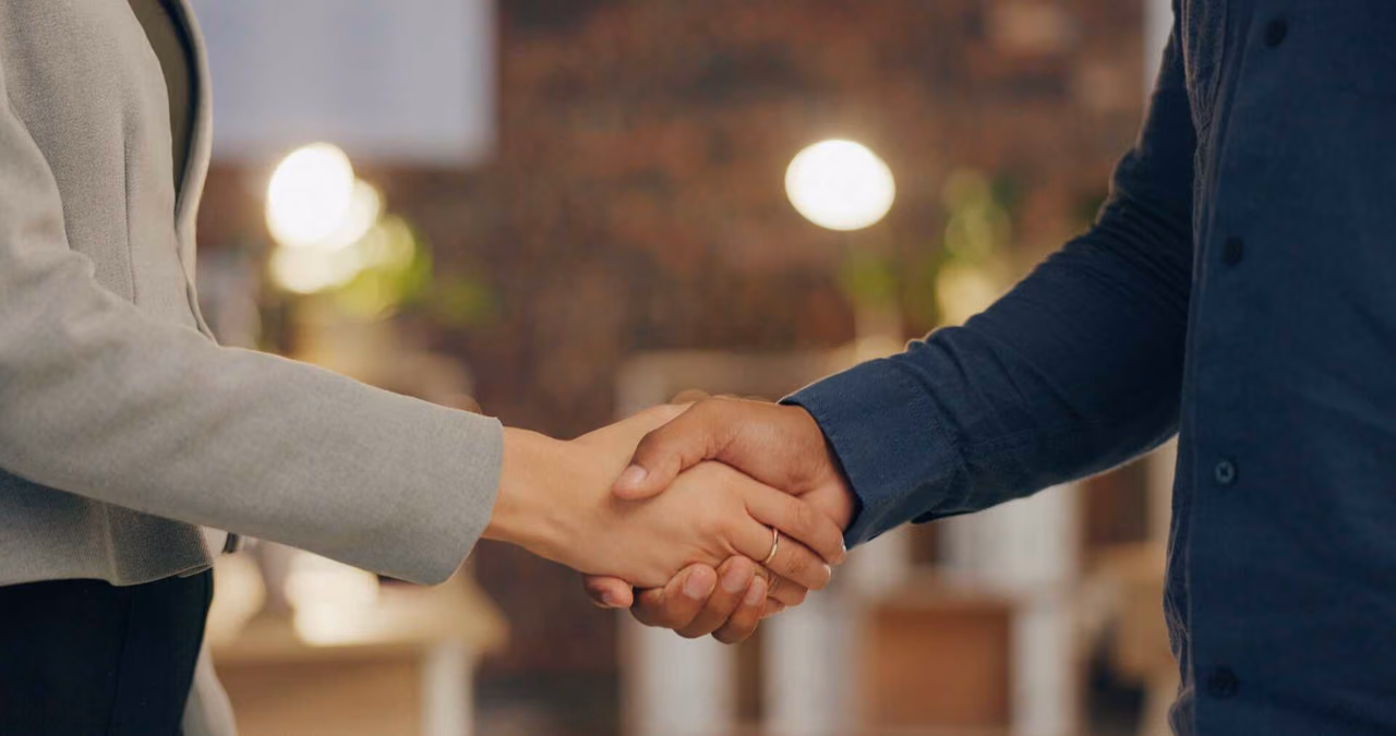 Handshake against a dark background