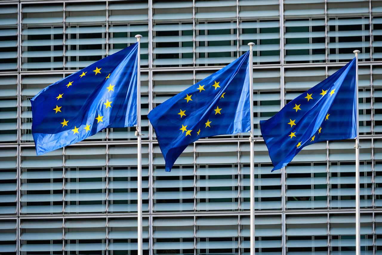 European Union flags in front of the European Commission building